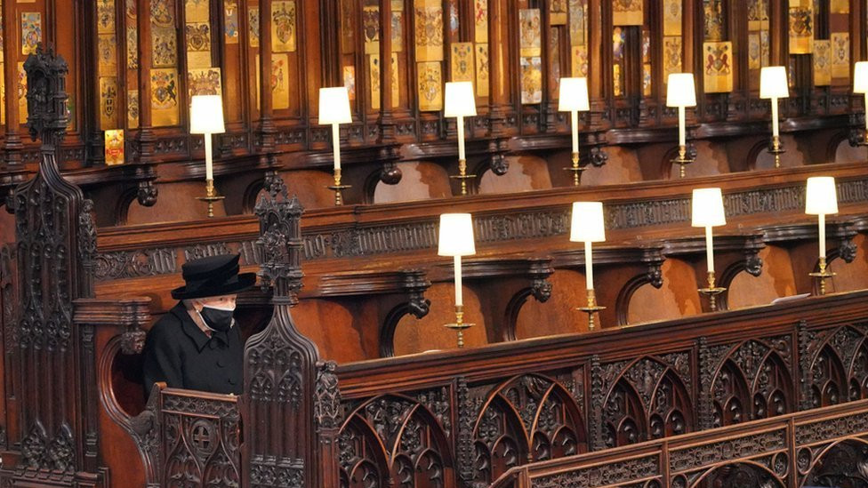 Queen Elizabeth II takes her seat for the funeral of the Duke of Edinburgh in St George's Chapel, Windsor Castle, Berkshire. 17 April 2021.