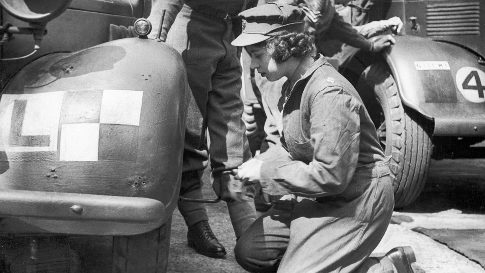 Princess Elizabeth learning basic car maintenance as a Second Subaltern in the ATS. 12 April 1945.