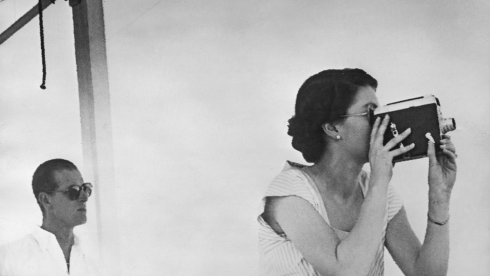 Queen Elizabeth II filming aboard the SS Gothic during the coronation world tour, 11 December 1953.