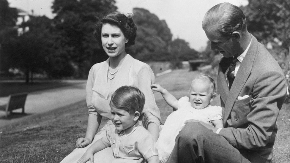 9th August 1951: Princess Elizabeth and Prince Philip, Duke of Edinburgh with their two children, Prince Charles and Princess Anne in the grounds of Clarence House, London