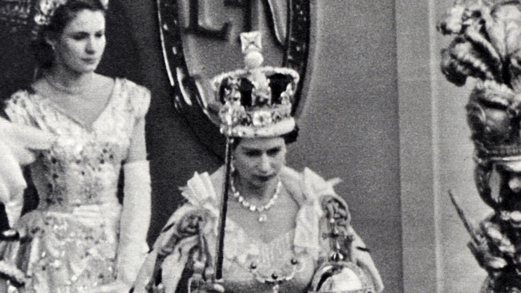 Queen Elizabeth at her coronation, carrying the sceptre topped with the Star of Africa in her right hand