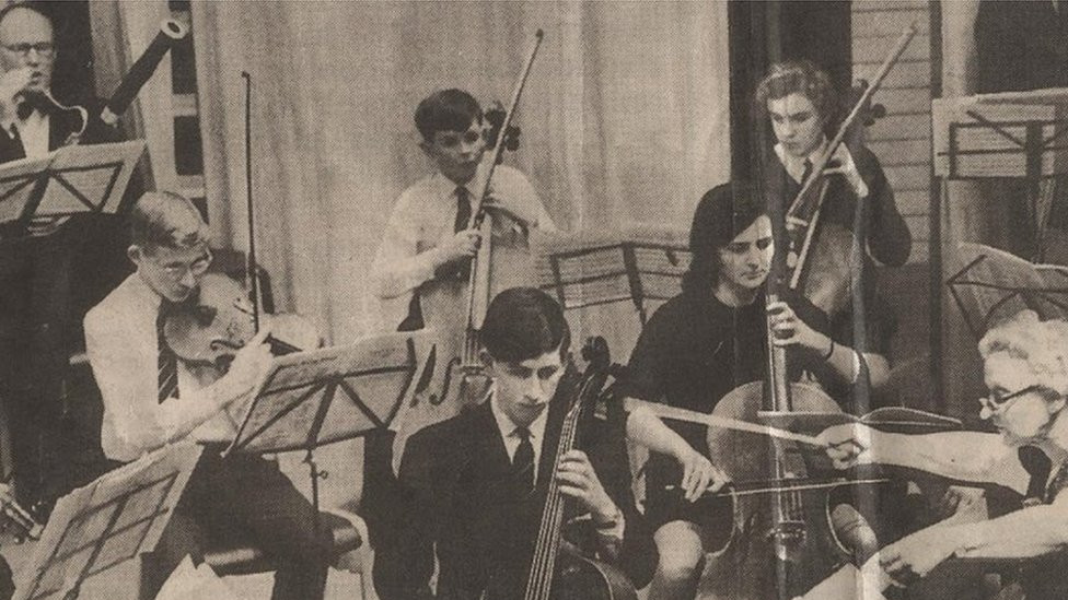 King Charles playing cello