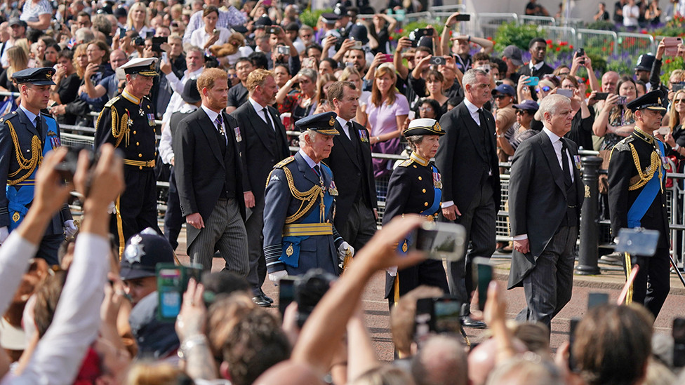 King Charles III and members of the royal family behind Queen Elizabeth II's flag-draped coffin as it is taken in procession on a Gun Carriage of The King's Troop Royal Horse Artillery from Buckingham Palace to Westminster Hall on 14 September 2022