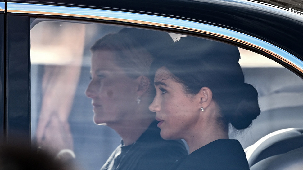 Sophie, Countess of Wessex and Meghan, Duchess of Sussex are driven behind the coffin of Queen Elizabeth II during a procession from Buckingham Palace to the Palace of Westminster, in London on 14 September 2022