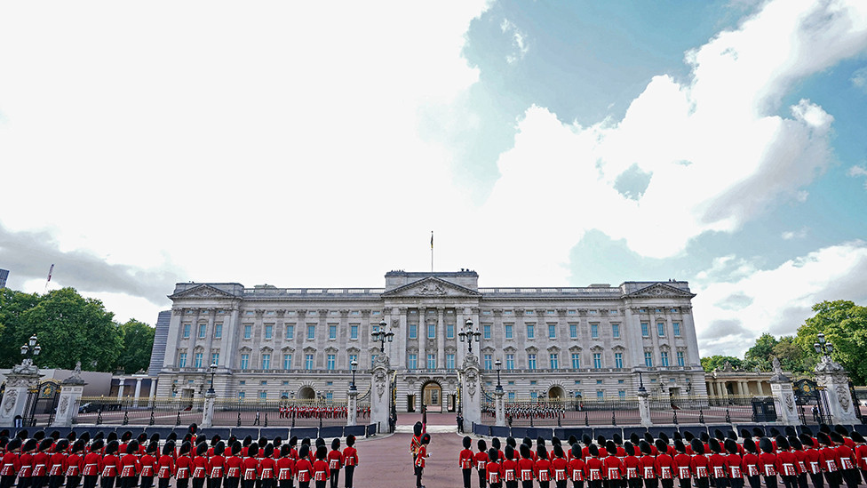 Coldstream Guards outside Buckingham Palace, ahead of the ceremonial procession of the coffin of Queen Elizabeth II from Buckingham Palace to Westminster Hall, London, on 14 September 2022