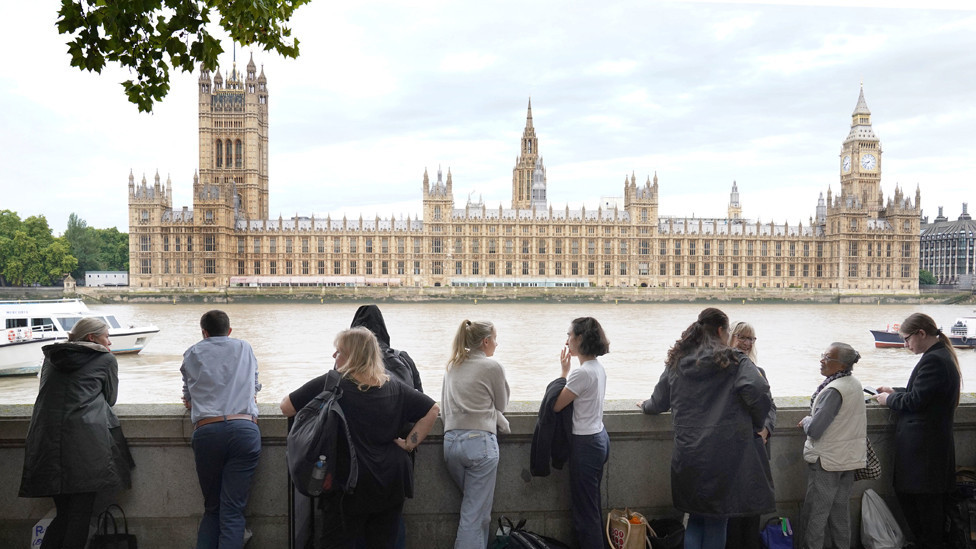 Members of the public join the queue on the South Bank, as they wait to view Queen Elizabeth II lying in state ahead of her funeral on Monday. 14 September 2022.