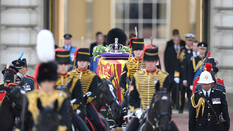 King Charles III and members of the royal family behind Queen Elizabeth II's flag-draped coffin as it is taken in procession on a Gun Carriage of The King's Troop Royal Horse Artillery from Buckingham Palace to Westminster Hall on 14 September 2022