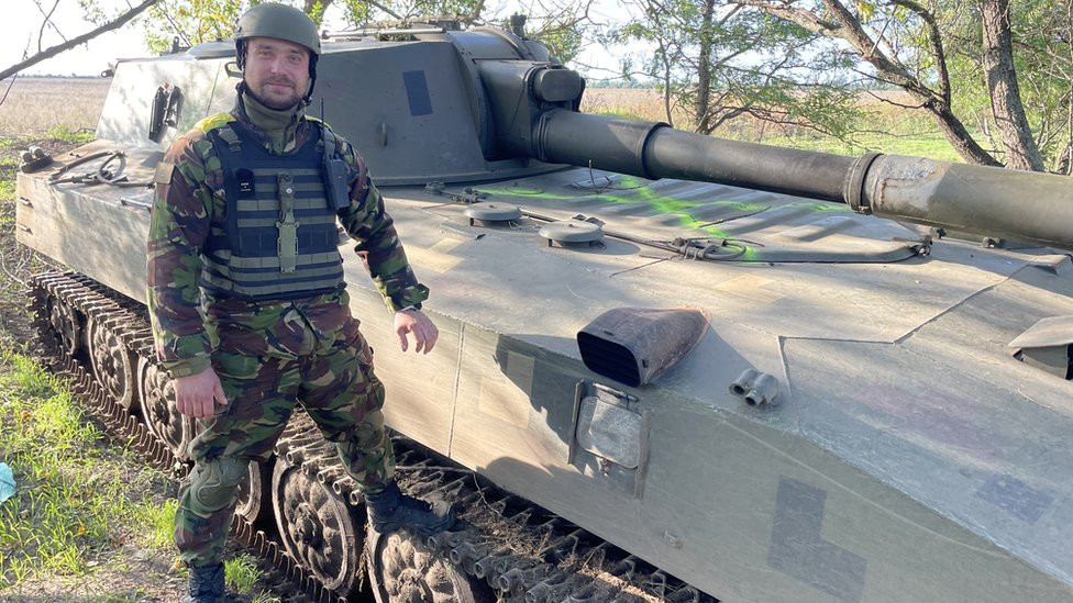 Stus, commander of the gunners standing next to the “Gvozdika” howitzer