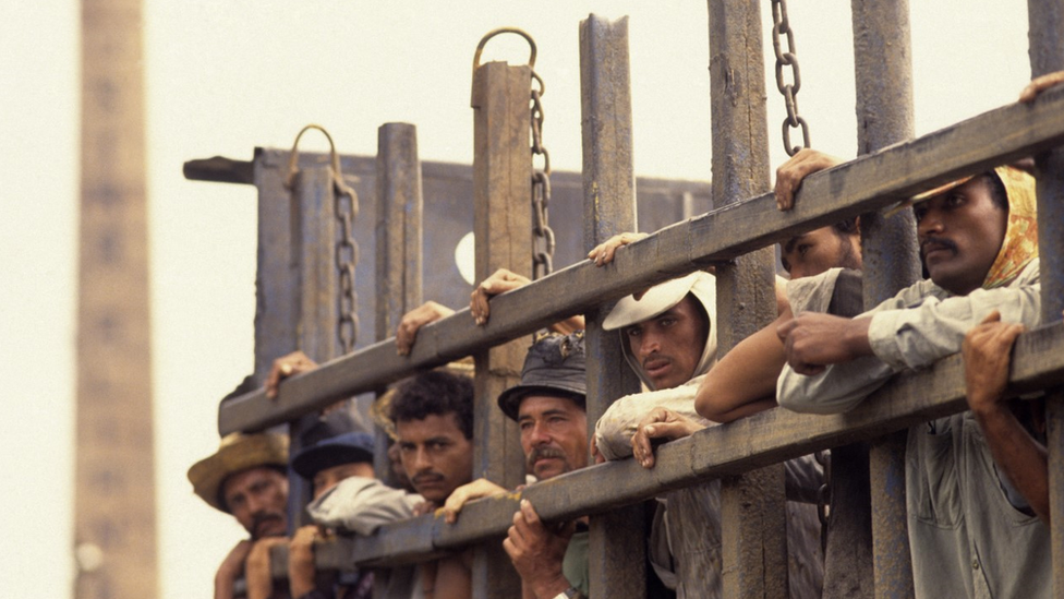 Sugarcane cutters transported in cattle truck to their work, Bahia State, Northeastern Brazil.