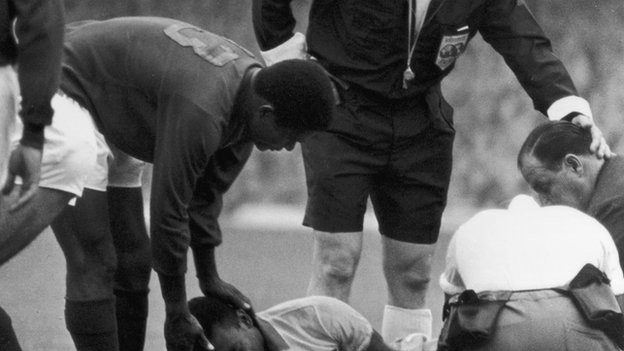 Pele is comforted by Portugal's Eusebio in 1966