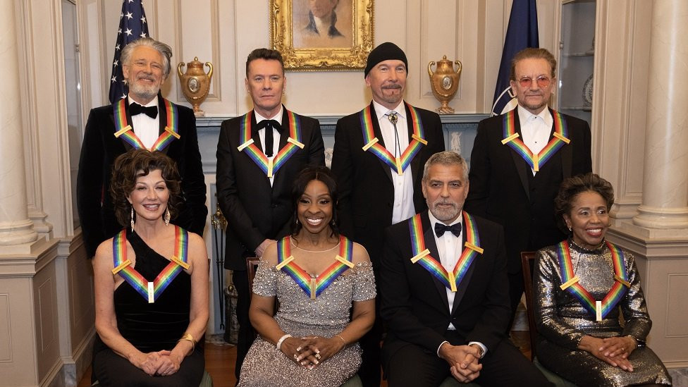 U2's Adam Clayton, Larry Mullen Jr, The Edge and Bono; along with Amy Grant, Gladys Knight, George Clooney and Talia Leon