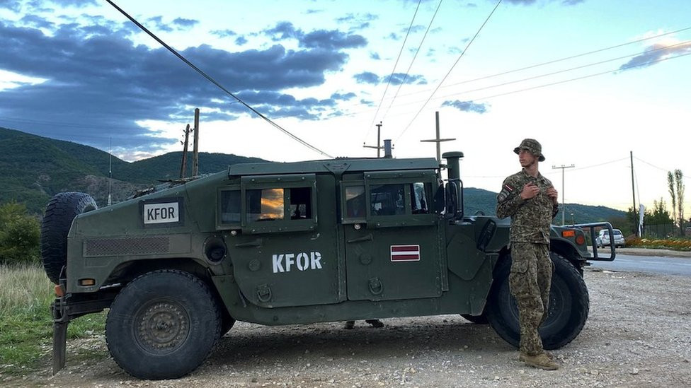 Latvian soldiers belonging to NATO's peacekeeping mission KFOR monitors a main road in Zubin Potok, Kosovo, September 20, 2022.