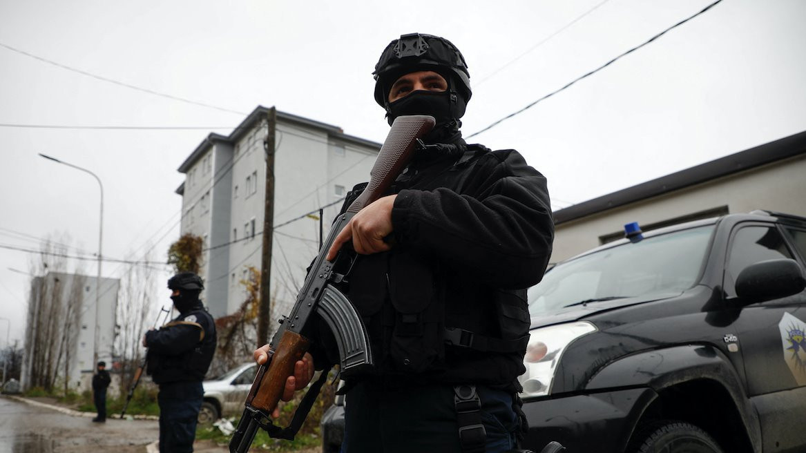 Kosovo police officers patrol an area in the northern part of the ethnically-divided town of Mitrovica, Kosovo, December 12, 2022.