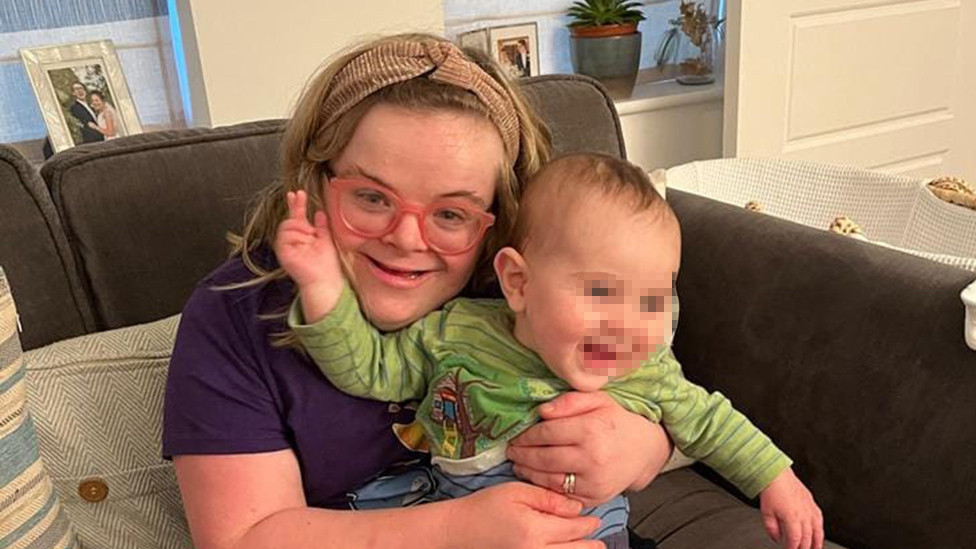 Heidi with a baby