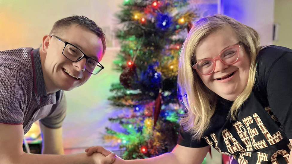 Heidi and James near a Christmas tree