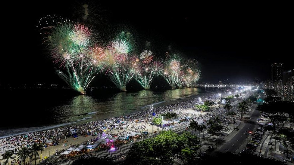 Fireworks fill the sky over Copacabana beach, in Rio de Janeiro