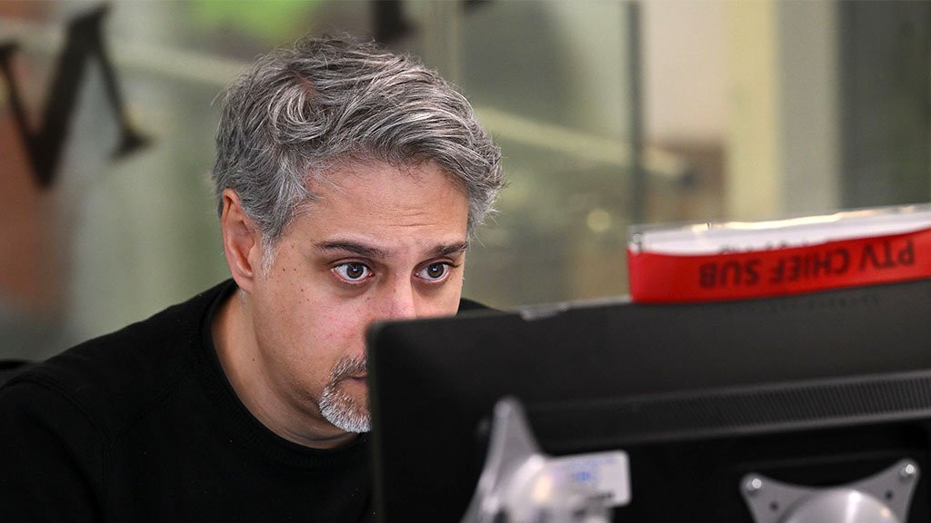 A BBC Persian journalist looks at his screen