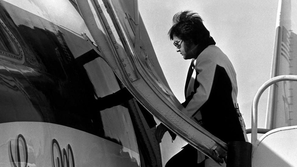 Elvis Presley boarding his private jet, named the Lisa Marie
