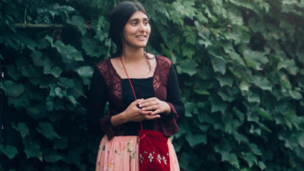 Izabela Tiberiade wearing a traditional dress