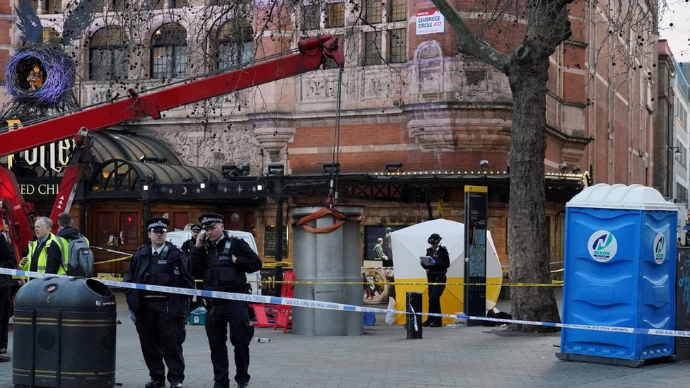 A police tent is erected at Cambridge Circus on the junction between Shaftesbury Avenue and Charing Cross Road in London, after a man died after being crushed by a telescopic urinal