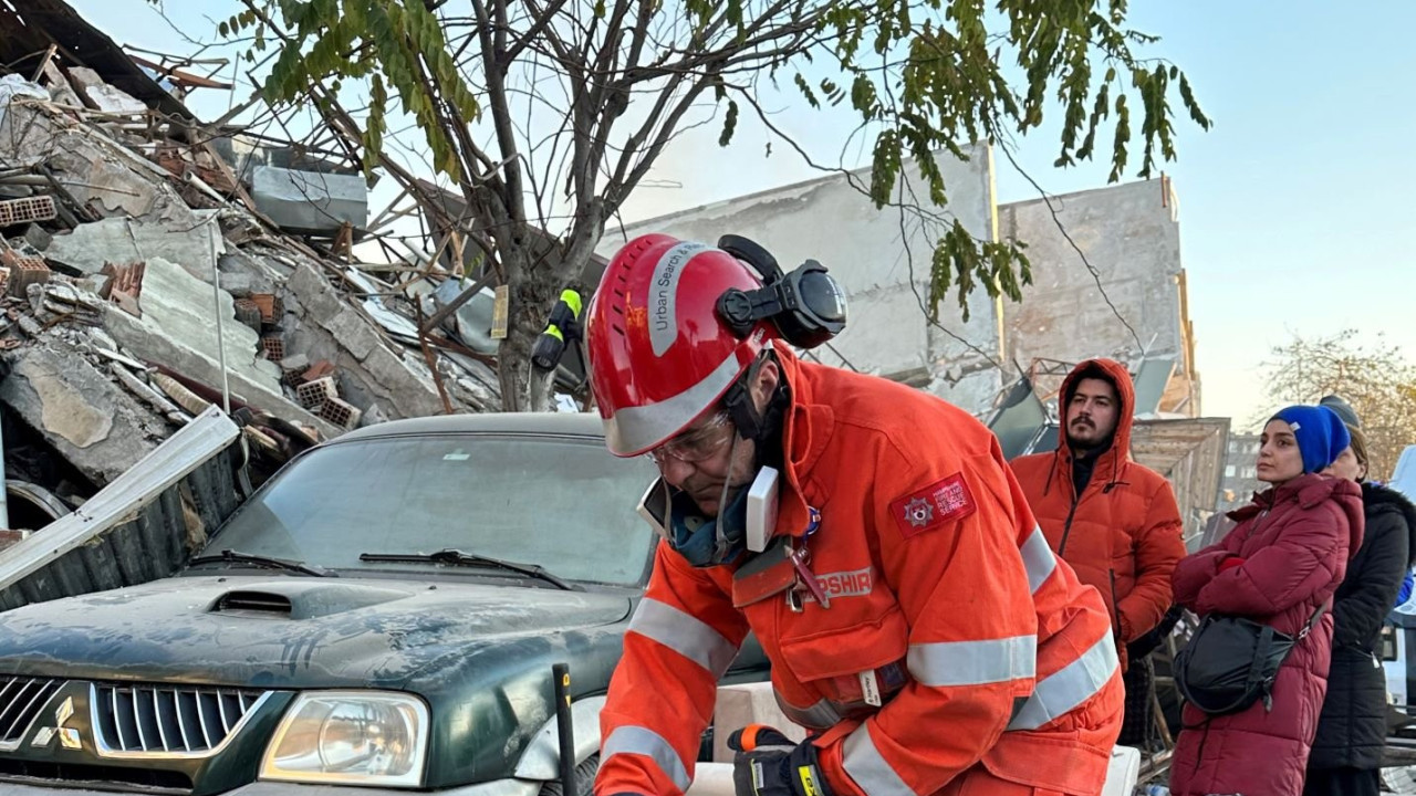 Rescue worker with sniffer dog