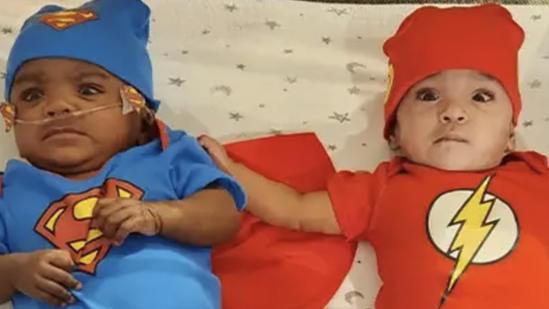 The kids in superhero costumes