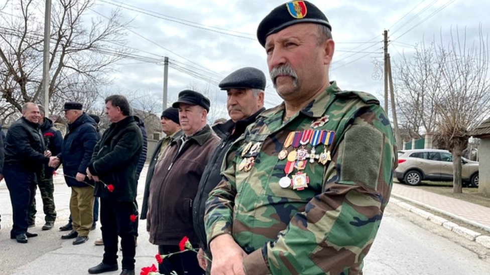 Vlad Untila attends a ceremony in the village of Molovata Noua