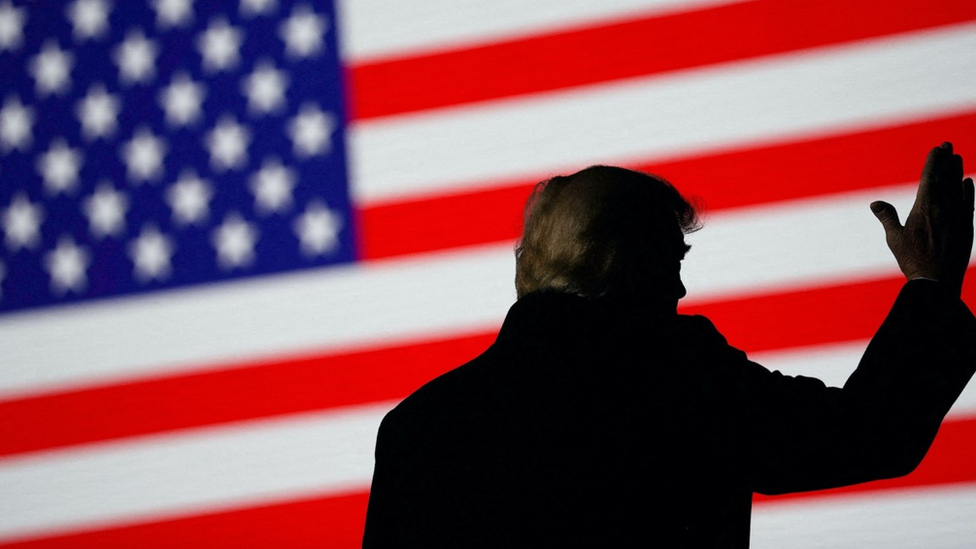Former U.S. President Donald Trump gestures during a rally in Conroe, Texas, U.S., January 29, 2022.