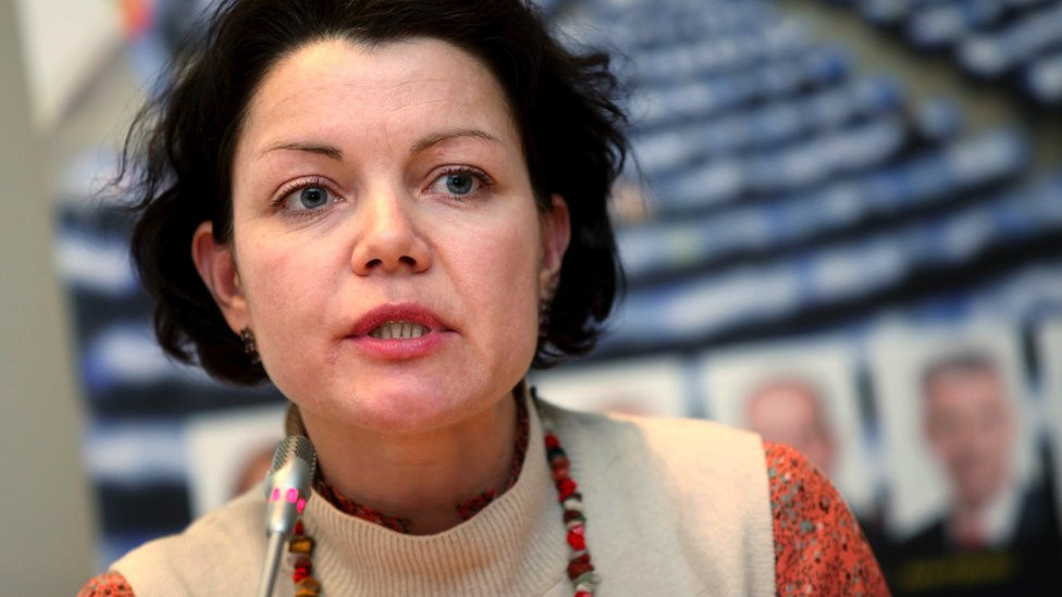 Close up of Ieva Raubishko speaking into a microphone