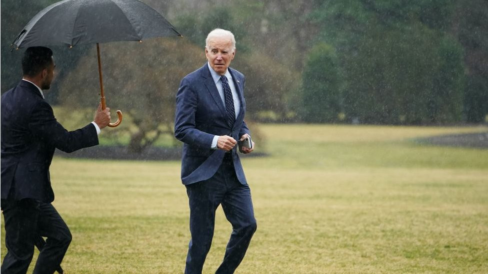Joe Biden jogs across the White House lawn after returning from his annual medical checkup in February