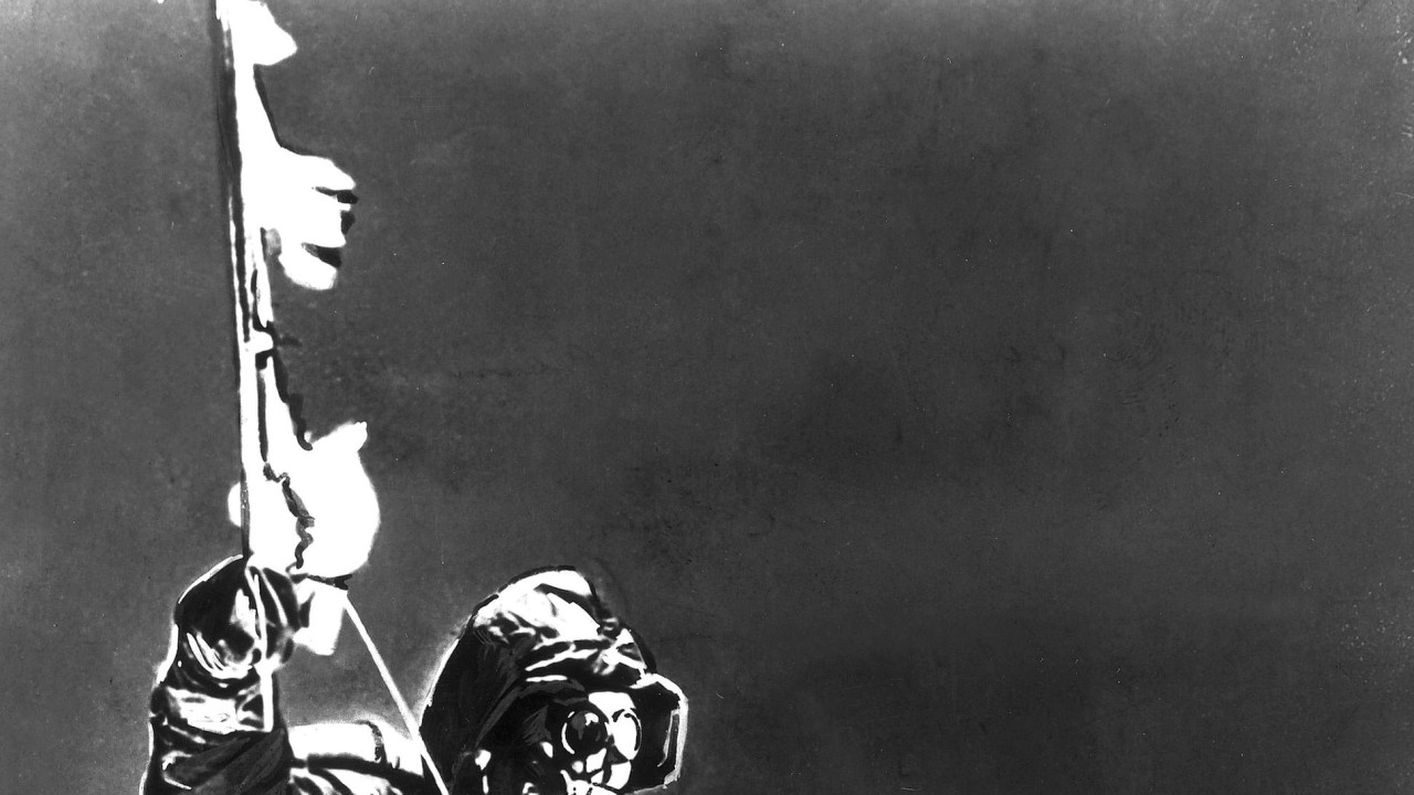 Sherpa Tenzing Norgay (1914 - 1986) holds an ice axe at the summit of Mt. Everest, Nepal, 1953