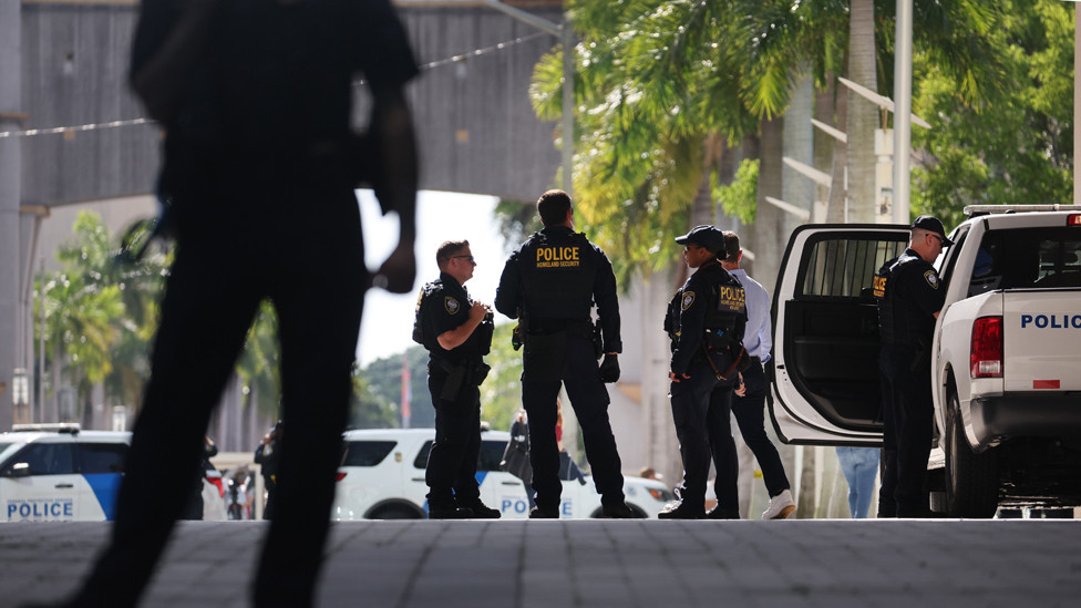 Law enforcement officials stand guard at a transit stop outside of the Wilkie D. Ferguson Jr. federal courthouse on June 13, 2023 in Miami, Florida