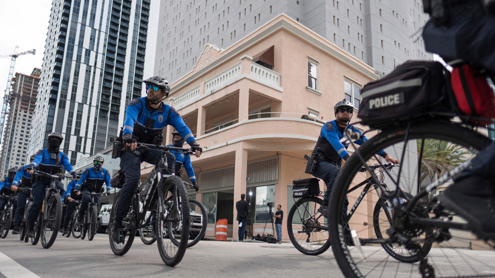 Miami Police Officers ride around the Wilkie D. Ferguson Jr. United States Federal Courthouse in Miami, Florida, on June 13, 2023