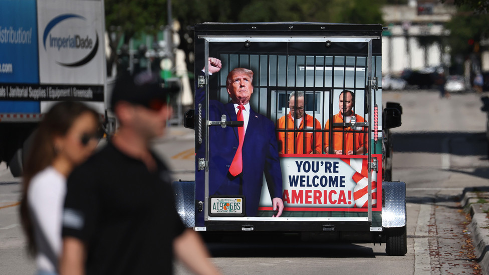 A supporter of former President Donald Trump pulls a trailer around outside the Wilkie D. Ferguson Jr. United States Federal Courthouse where former U.S. President Donald Trump is set to appear in front of a judge on June 13, 2023 in Miami, Florida