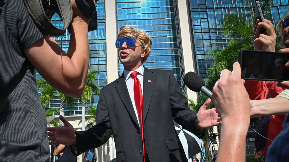 A Trump impersonator speaks to the media outside the Wilkie D. Ferguson Jr. United States Courthouse before the arraignment of former President Donald Trump in Miami, Florida on June 13, 2023