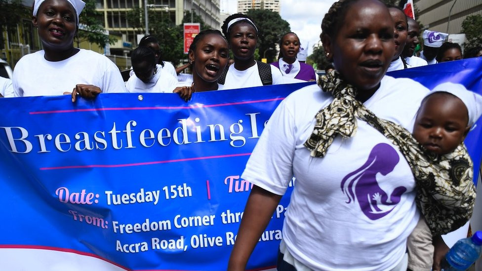 A group of protesters march towards a restaurant after a female client was allegedly thrown out for breastfeeding and not covering up in Nairobi's Central Business District on 15 May 2018.