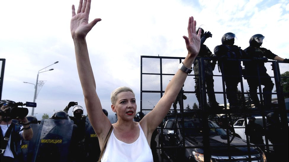 Maria Kolesnikova stands in front of police barricade during 2020 Minsk protests