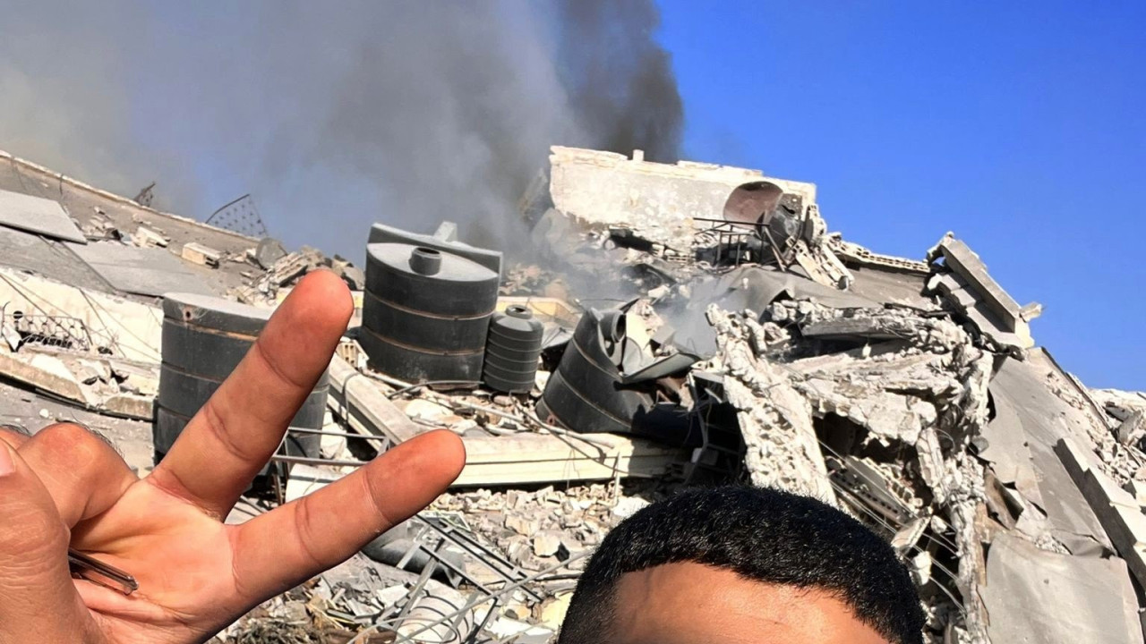 Mohamed outside his destroyed apartment