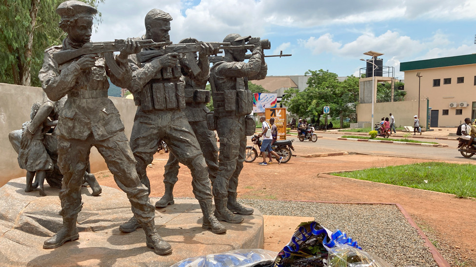 Statue of Russian troops in Bangui, Central Africa Republic with floral tributes