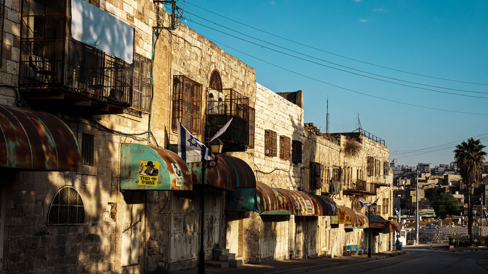 Buildings in Hebron's Old City with windows covered by cages