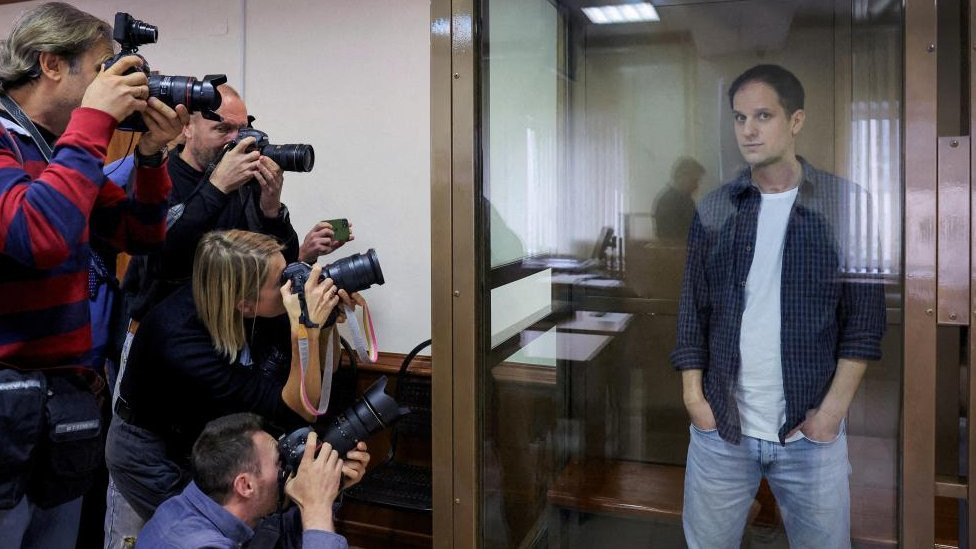 Wall Street Journal reporter Evan Gershkovich stands inside an enclosure for defendants before a court hearing to consider an appeal against his pre-trial detention on espionage charges in Moscow, Russia, October 10, 2023