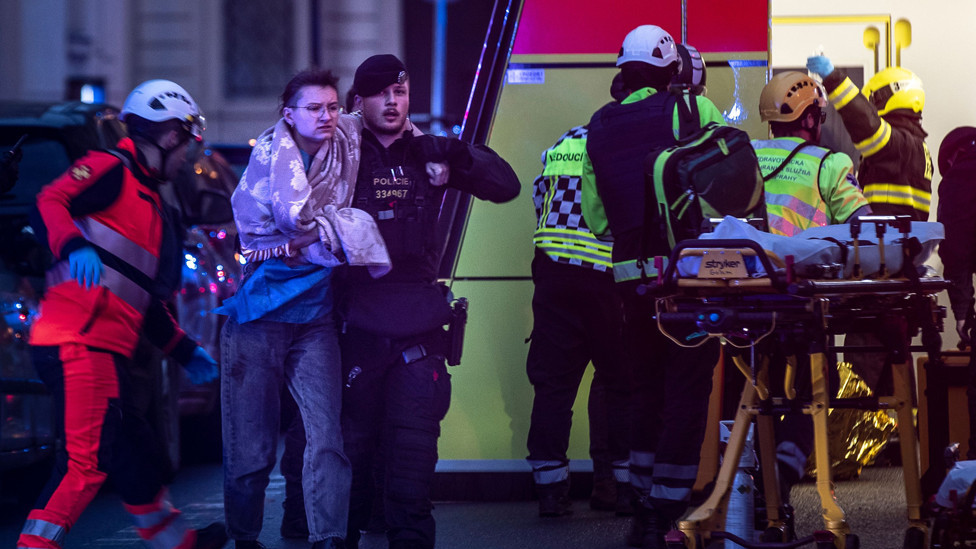 Emergency service members help people hurt in a shooting at the Faculty of Arts has 14 victims, there will be a state mourning on Saturday, center, Prague, Czech republic - 21 Dec 2023