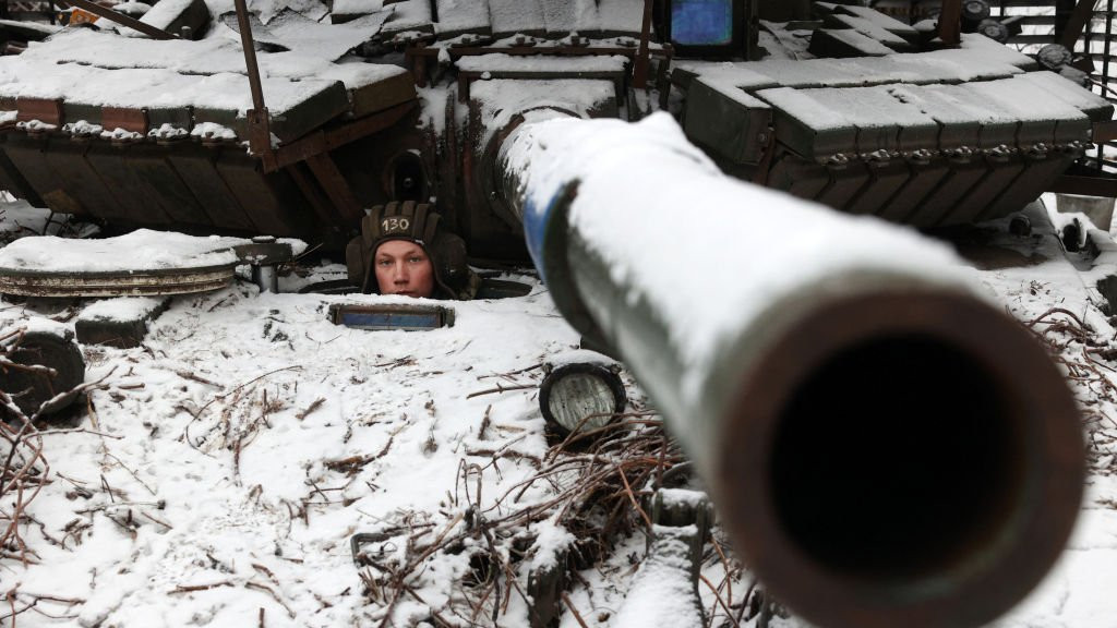 A Ukrainian soldier looks out from a tank as he holds his position near to the town of Bakhmut, Donetsk region, on December 13, 2023