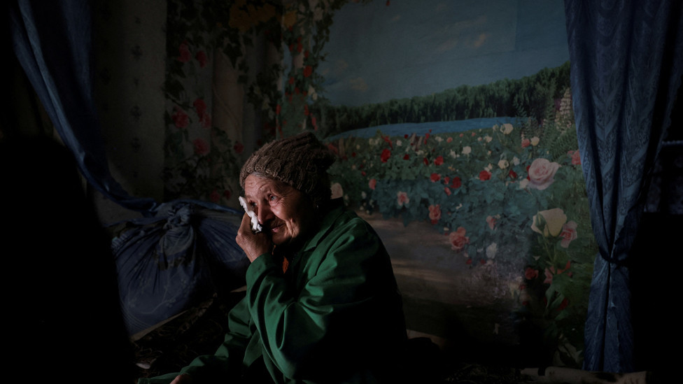 Lyubov Vasilivna, 71, reacts when listing reasons to remain in her home and not evacuate from the village of Semenivka, near the frontline town of Avdiivka, in the eastern Donetsk region, Ukraine, March 28, 2023.