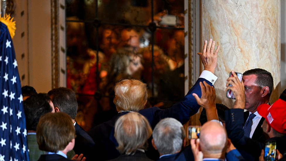 Former US president Donald Trump leaves after speaking during a press conference following his court appearance over an alleged 'hush-money' payment, at his Mar-a-Lago estate in Palm Beach, Florida, on April 4, 2023.