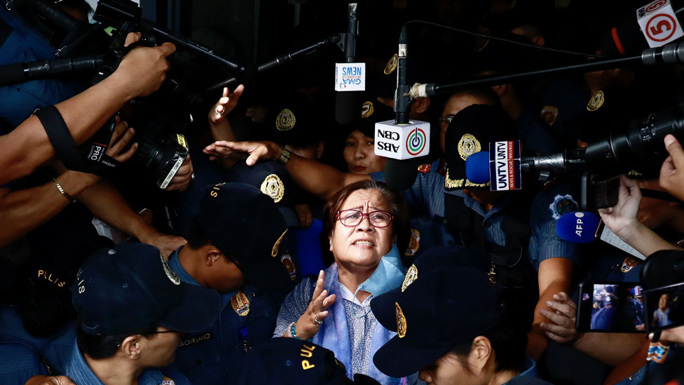 Former senator Leila De Lima (C) reacts after attending a court hearing in Muntinlupa city, Metro Manila, Philippines, 13 November 2023.