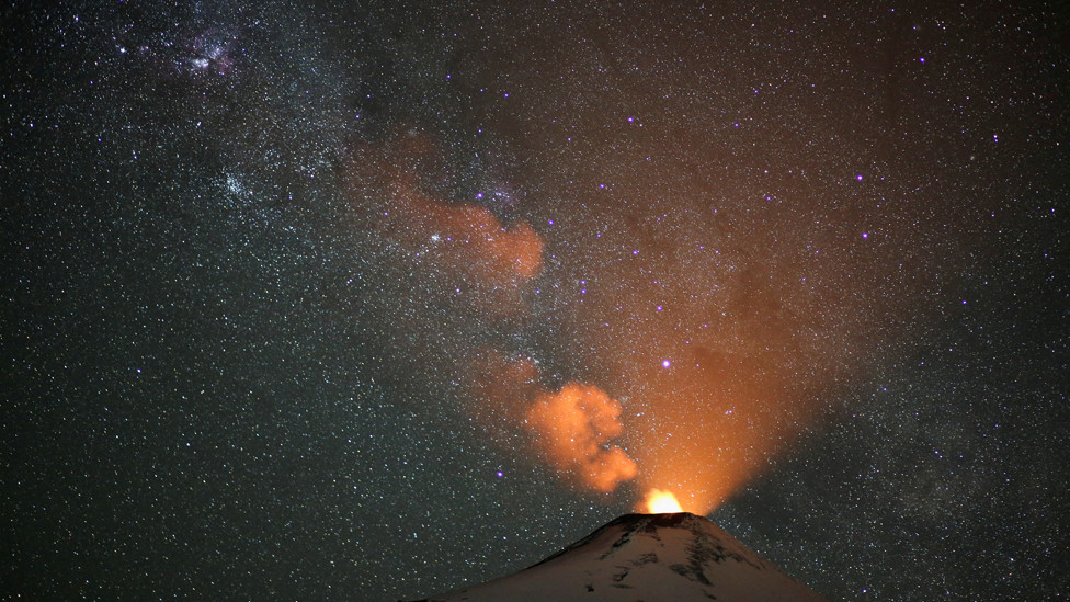 Plumes of smoke rise from the snow covered volcano Villarrica, in Pucon, Chile. December 7, 2023.