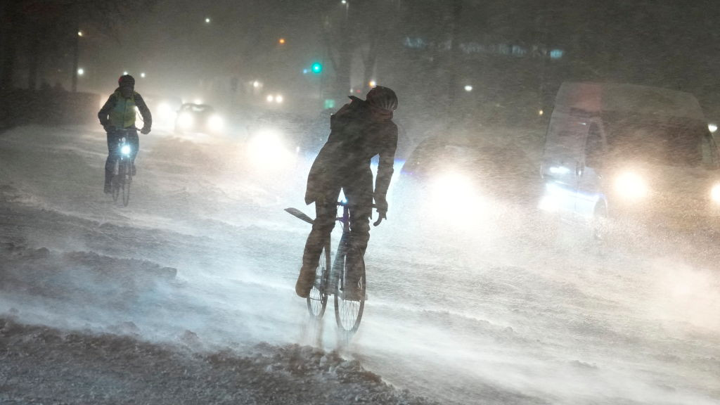 Cyclists in Aalborg, Denmark, during heavy snowfall. Some parts of eastern Denmark could see up to 70cm (26 inches) of snow by Thursday.