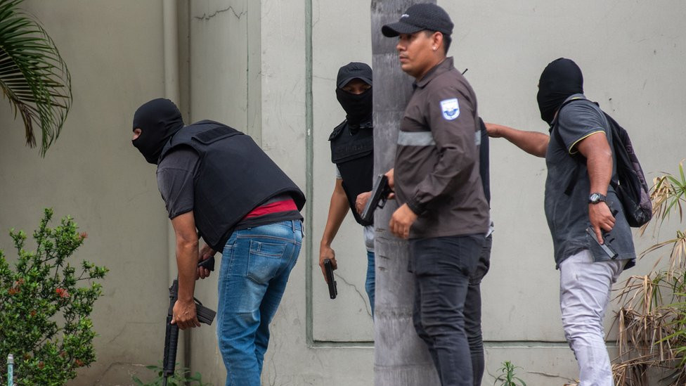 Police officers carry out an operation at the headquarters of TC television station where armed, hooded men entered and subdued staff during a live broadcast, in Guayaquil, Ecuador, 09 January 2024.