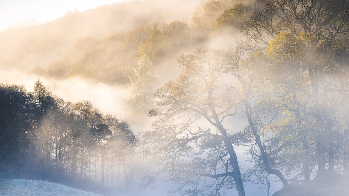 A frosty and misty dawn in autumn on the River Brathay, in the Lake District National Park